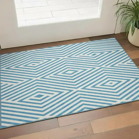 Teal And Ivory Geometric Washable Area Rug With UV Protection Photo 1