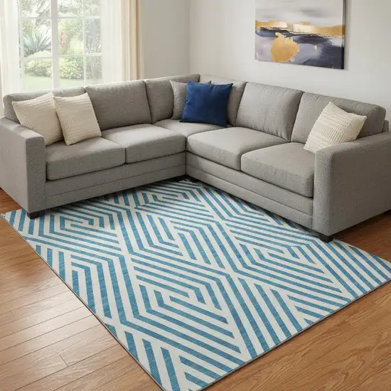 Teal And Ivory Geometric Washable Area Rug With UV Protection Photo 1