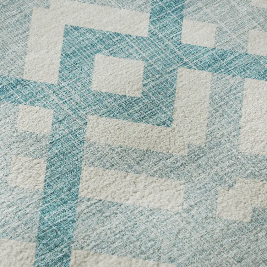 Teal And Ivory Geometric Washable Area Rug With UV Protection Photo 1