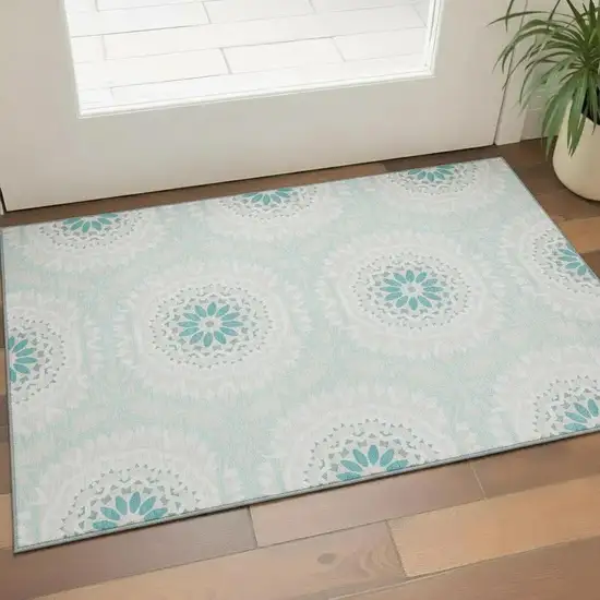 Teal And Ivory Geometric Washable Area Rug With UV Protection Photo 1