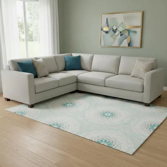 Teal And Ivory Geometric Washable Area Rug With UV Protection Photo 1