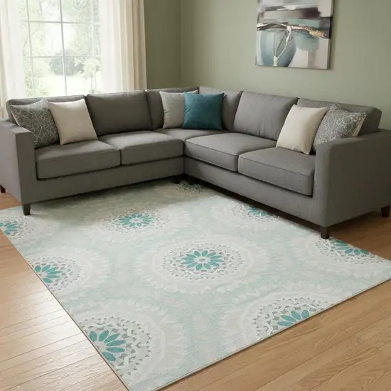 Teal And Ivory Geometric Washable Area Rug With UV Protection Photo 1