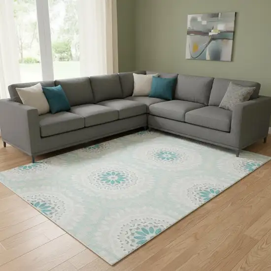 Teal And Ivory Geometric Washable Area Rug With UV Protection Photo 1