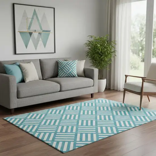 Teal And Ivory Geometric Washable Area Rug With UV Protection Photo 1