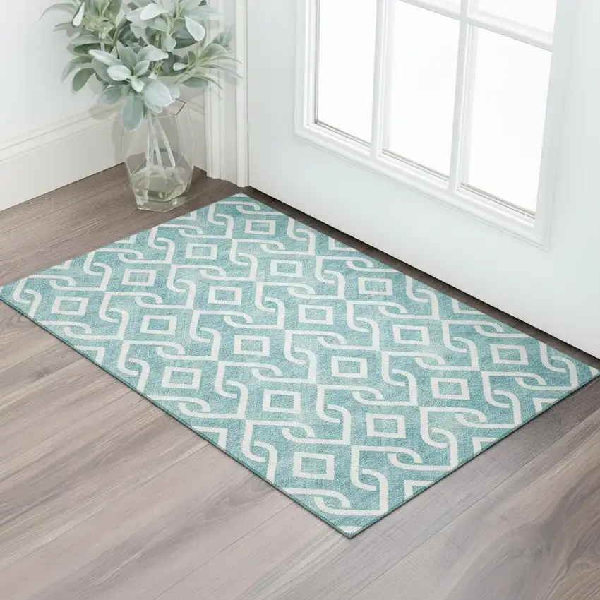 Teal And Ivory Geometric Washable Area Rug With UV Protection Photo 1