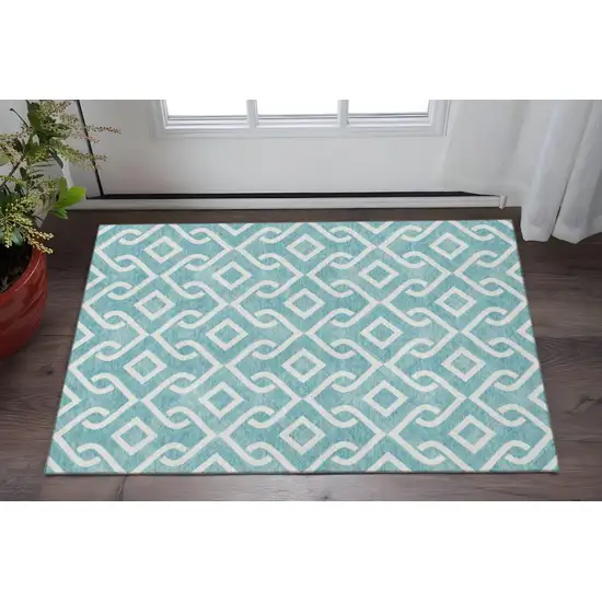 Teal And Ivory Geometric Washable Area Rug With UV Protection Photo 2