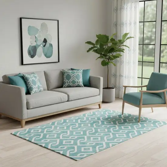 Teal And Ivory Geometric Washable Area Rug With UV Protection Photo 1