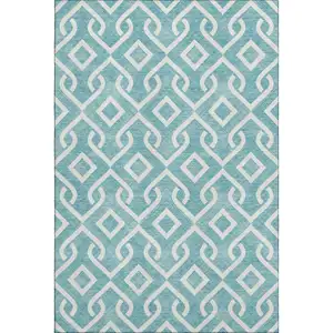 Photo of Teal And Ivory Geometric Washable Area Rug With UV Protection