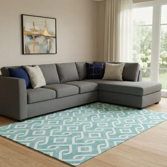 Teal And Ivory Geometric Washable Area Rug With UV Protection Photo 1