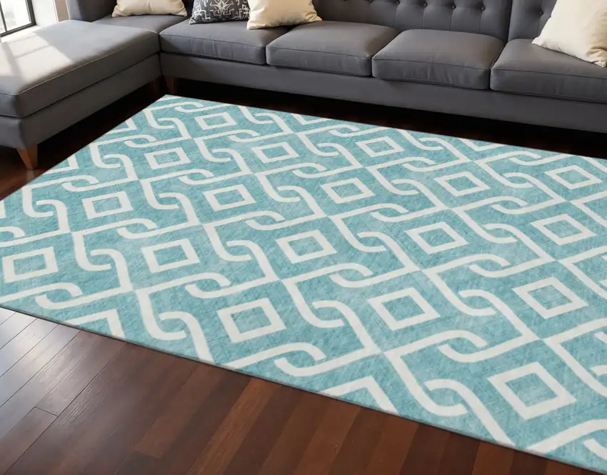 Teal And Ivory Geometric Washable Area Rug With UV Protection Photo 2