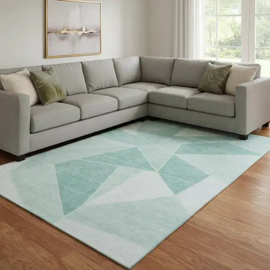 Teal And Ivory Geometric Washable Area Rug With UV Protection Photo 1