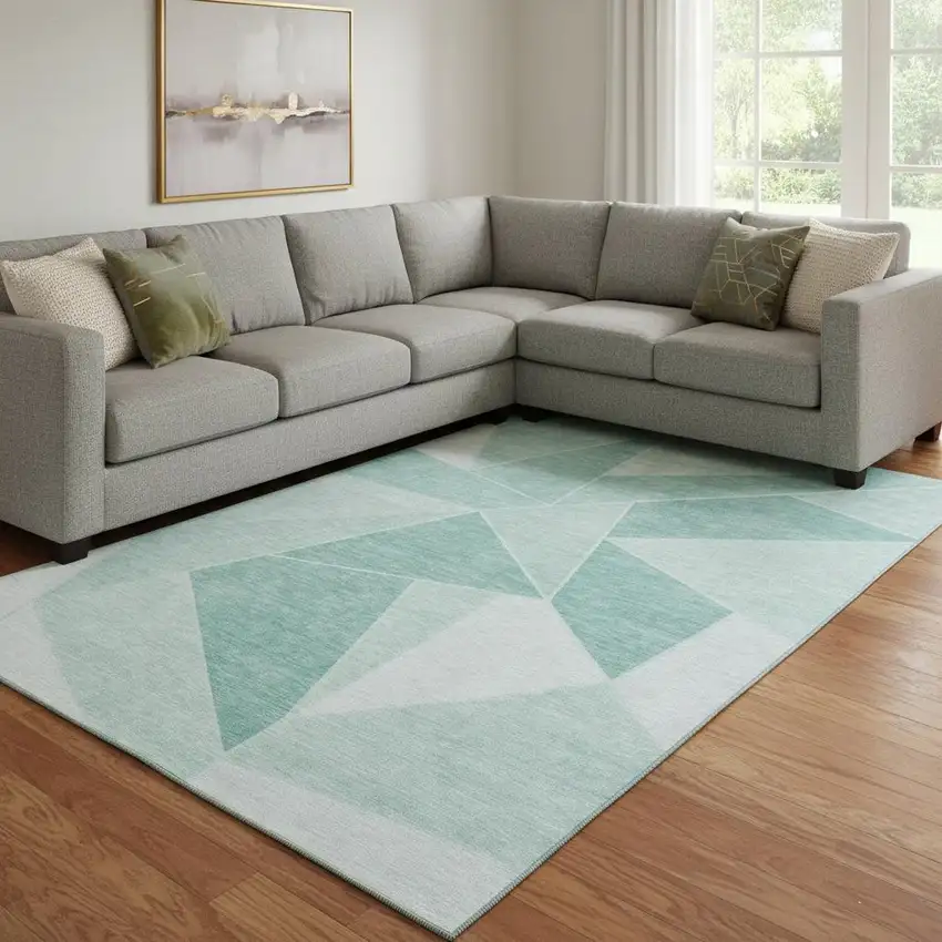 Teal And Ivory Geometric Washable Area Rug With UV Protection Photo 1