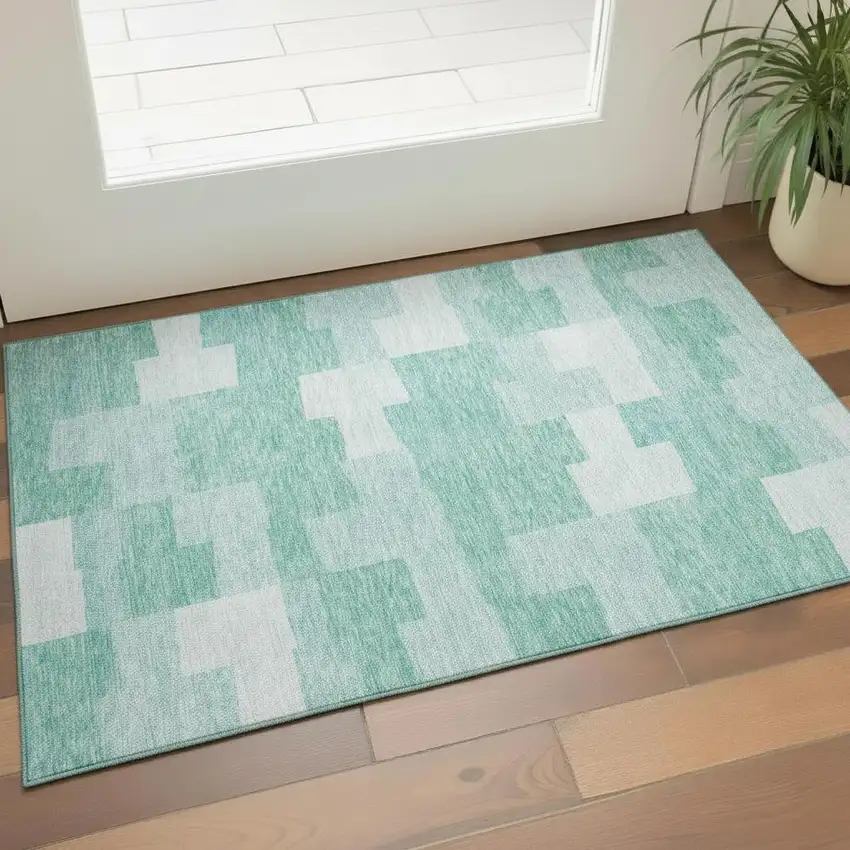 Teal And Ivory Geometric Washable Area Rug With UV Protection Photo 1