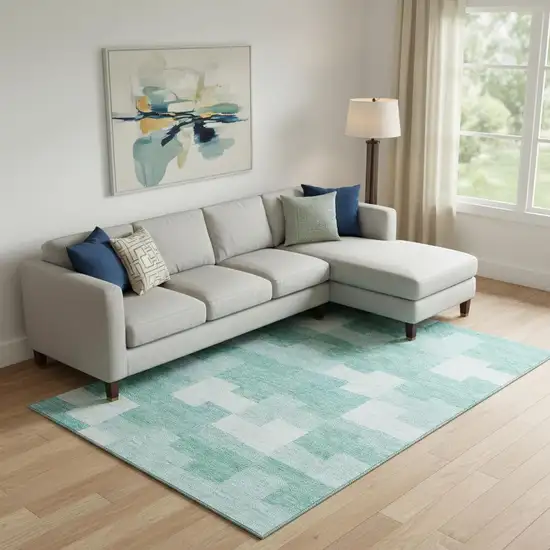 Teal And Ivory Geometric Washable Area Rug With UV Protection Photo 1