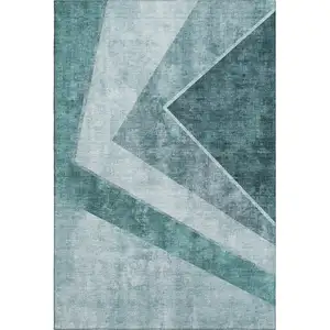 Photo of Teal And Ivory Geometric Washable Area Rug With UV Protection
