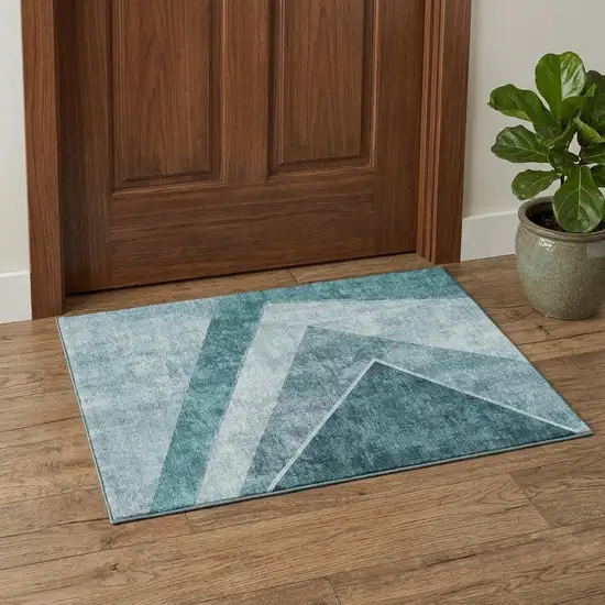 Teal And Ivory Geometric Washable Area Rug With UV Protection Photo 1