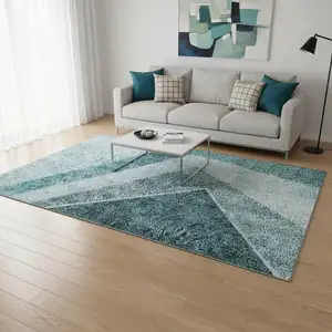 Photo of Teal And Ivory Geometric Washable Area Rug With UV Protection