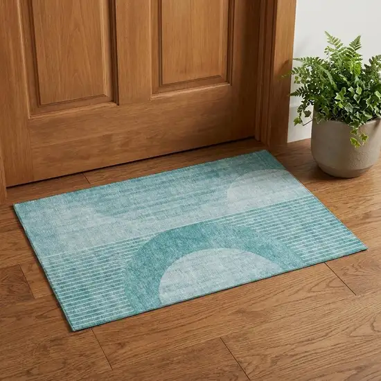 Teal And Ivory Geometric Washable Area Rug With UV Protection Photo 1