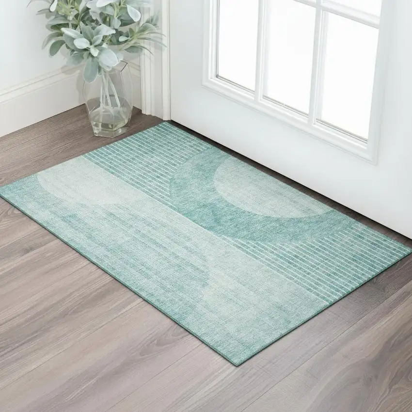 Teal And Ivory Geometric Washable Area Rug With UV Protection Photo 1
