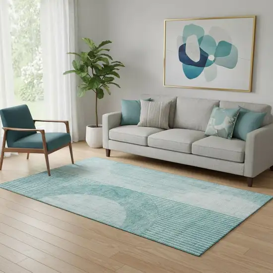 Teal And Ivory Geometric Washable Area Rug With UV Protection Photo 1