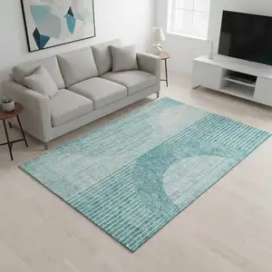 Photo of Teal And Ivory Geometric Washable Area Rug With UV Protection