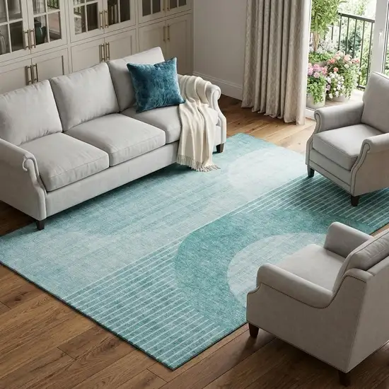 Teal And Ivory Geometric Washable Area Rug With UV Protection Photo 1