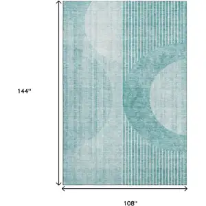 Photo of Teal And Ivory Geometric Washable Area Rug With UV Protection