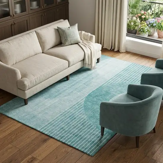 Teal And Ivory Geometric Washable Area Rug With UV Protection Photo 1