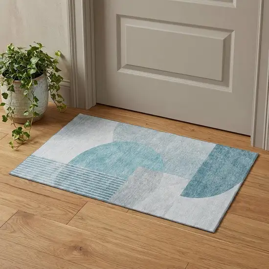 Teal And Ivory Geometric Washable Area Rug With UV Protection Photo 1
