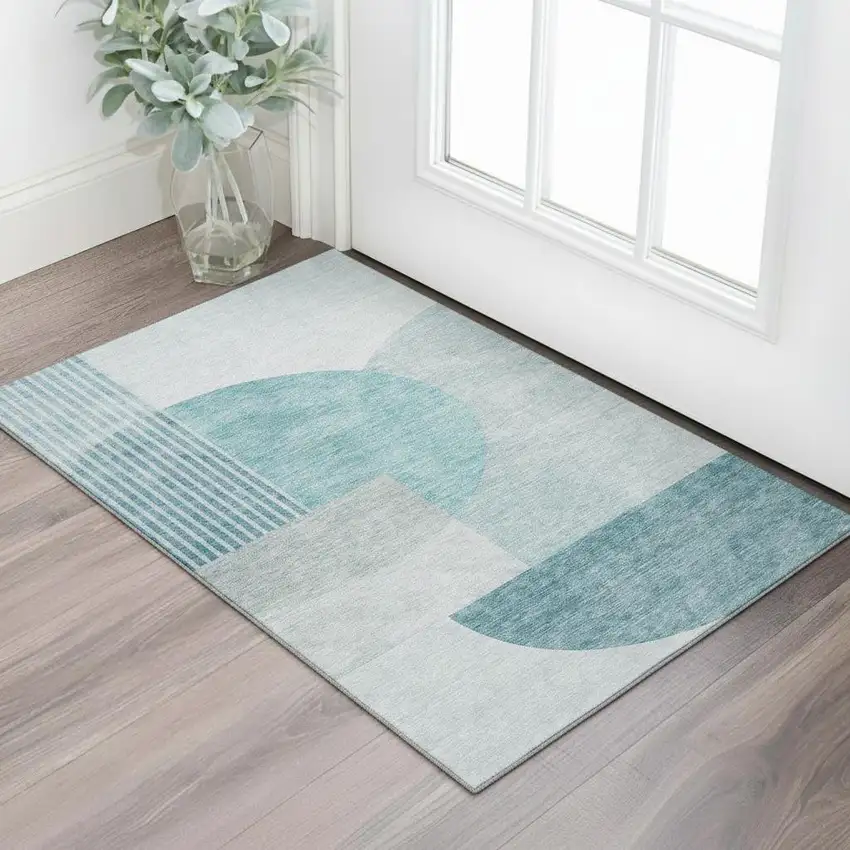 Teal And Ivory Geometric Washable Area Rug With UV Protection Photo 1