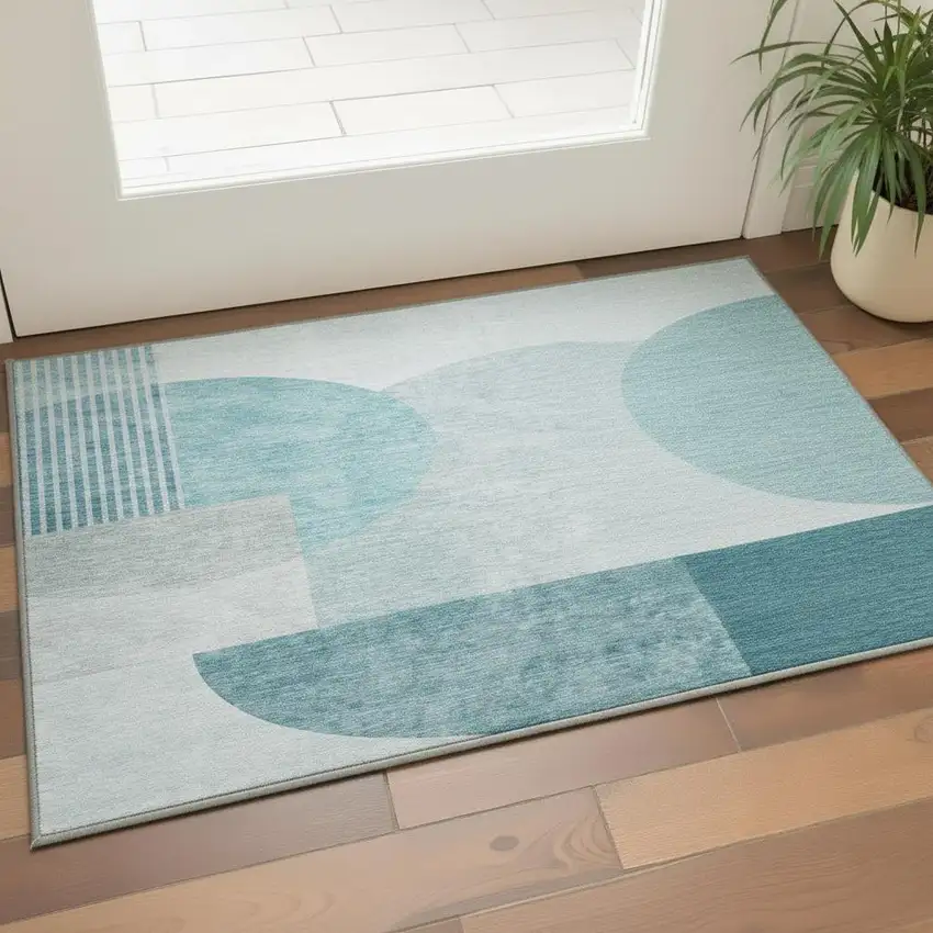 Teal And Ivory Geometric Washable Area Rug With UV Protection Photo 2
