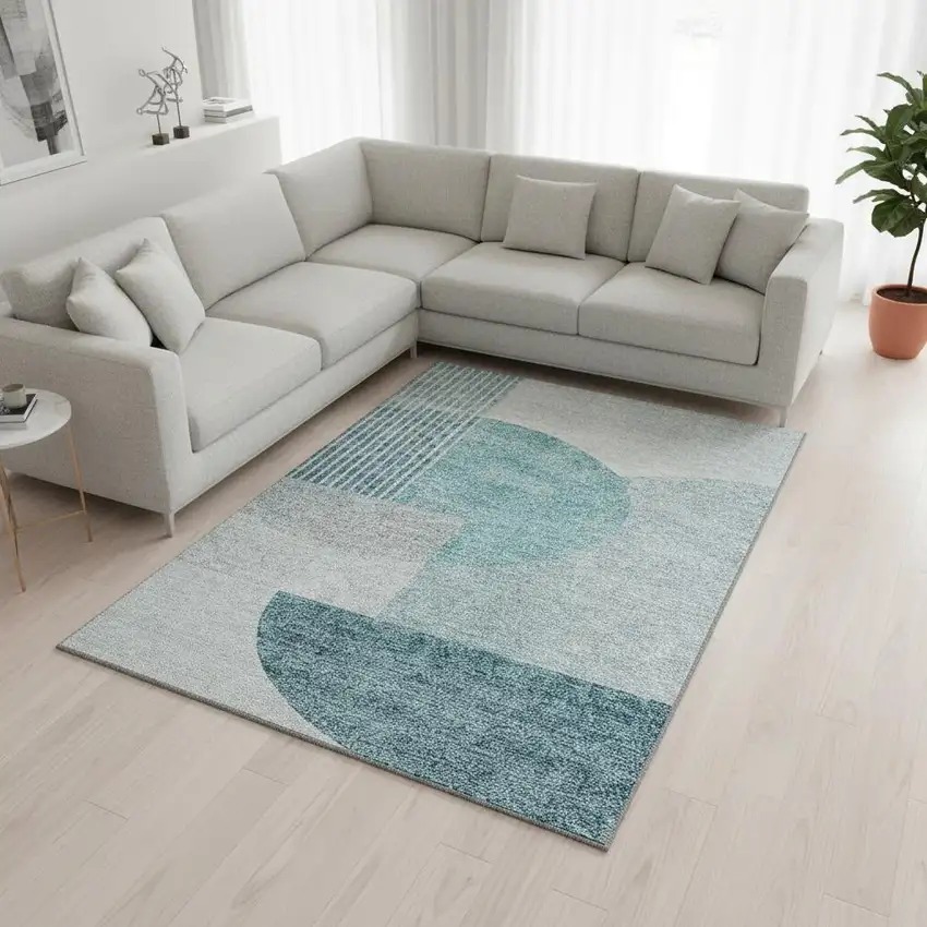 Teal And Ivory Geometric Washable Area Rug With UV Protection Photo 1