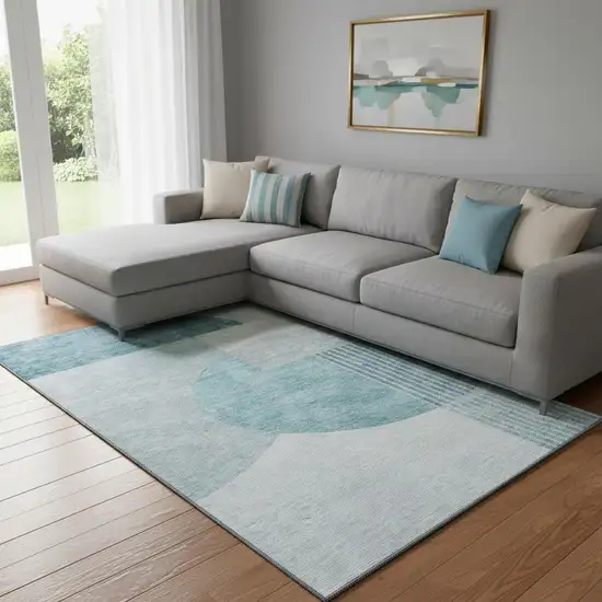 Teal And Ivory Geometric Washable Area Rug With UV Protection Photo 1