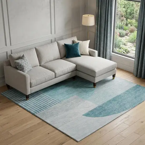 Teal And Ivory Geometric Washable Area Rug With UV Protection Photo 1