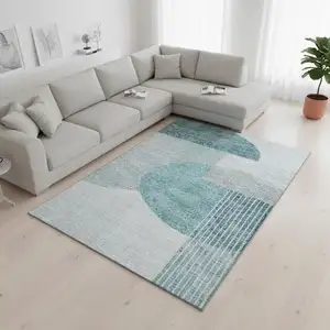 Photo of Teal And Ivory Geometric Washable Area Rug With UV Protection
