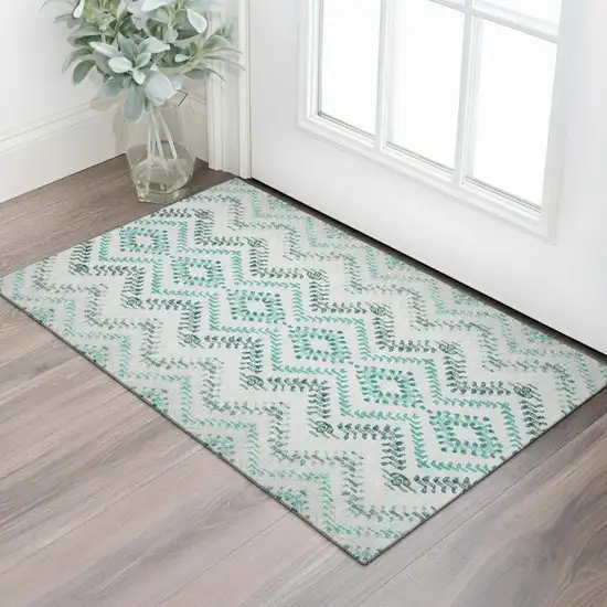 Teal And Ivory Geometric Washable Area Rug With UV Protection Photo 1