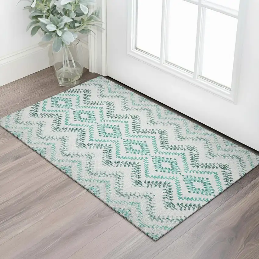 Teal And Ivory Geometric Washable Area Rug With UV Protection Photo 1