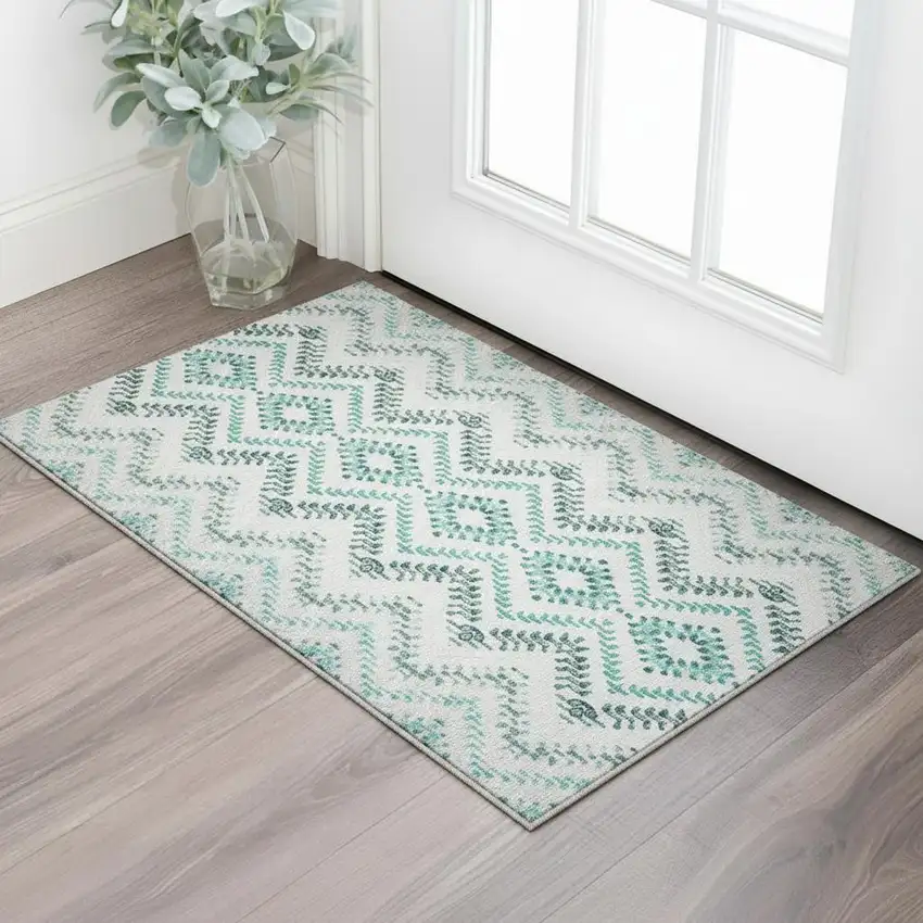 Teal And Ivory Geometric Washable Area Rug With UV Protection Photo 2