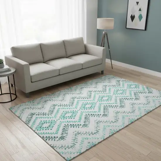 Teal And Ivory Geometric Washable Area Rug With UV Protection Photo 1