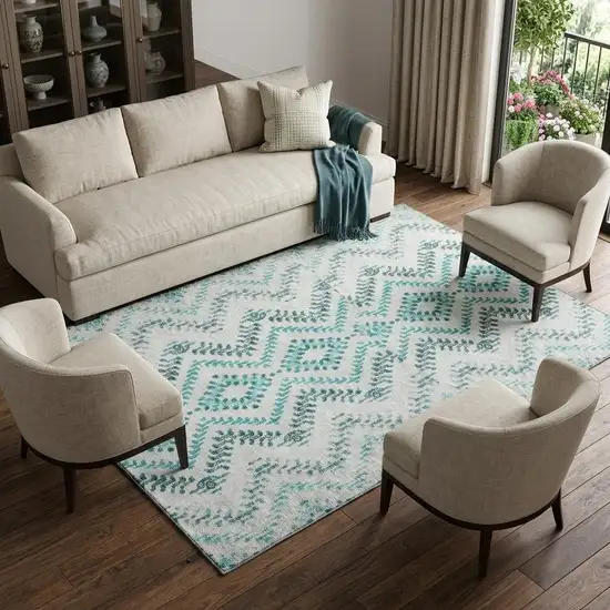 Teal And Ivory Geometric Washable Area Rug With UV Protection Photo 1