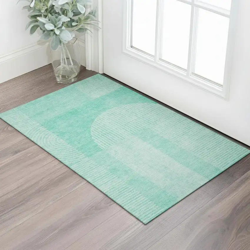 Teal And Ivory Geometric Washable Area Rug With UV Protection Photo 1