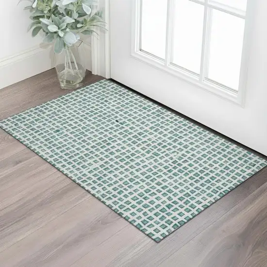 Teal And Ivory Geometric Washable Area Rug With UV Protection Photo 1