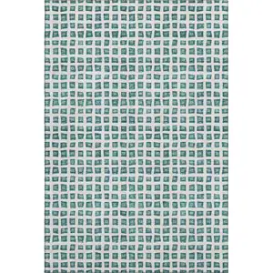 Photo of Teal And Ivory Geometric Washable Area Rug With UV Protection