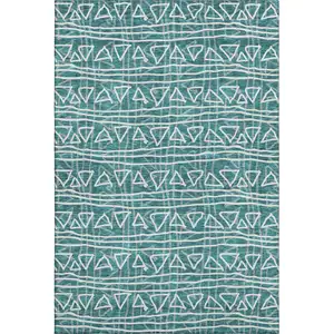 Photo of Teal And Ivory Geometric Washable Area Rug With UV Protection