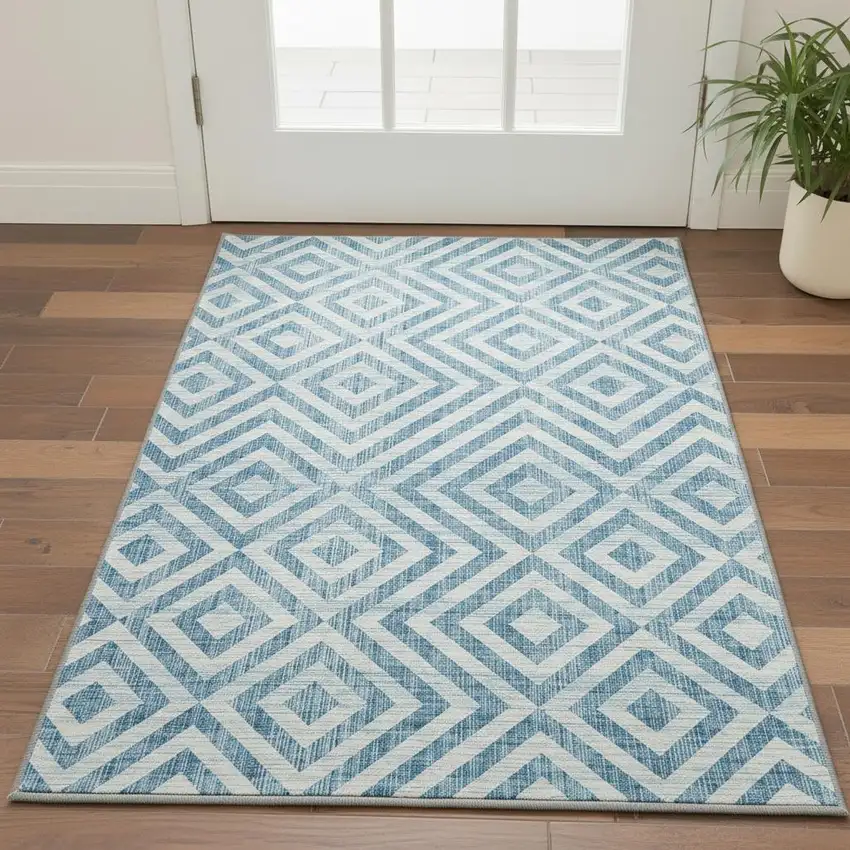 Teal And Ivory Geometric Washable Area Rug With UV Protection Photo 2
