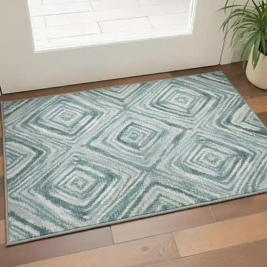 Teal And Ivory Geometric Washable Area Rug With UV Protection Photo 2