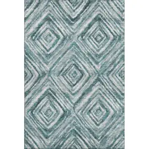 Photo of Teal And Ivory Geometric Washable Area Rug With UV Protection