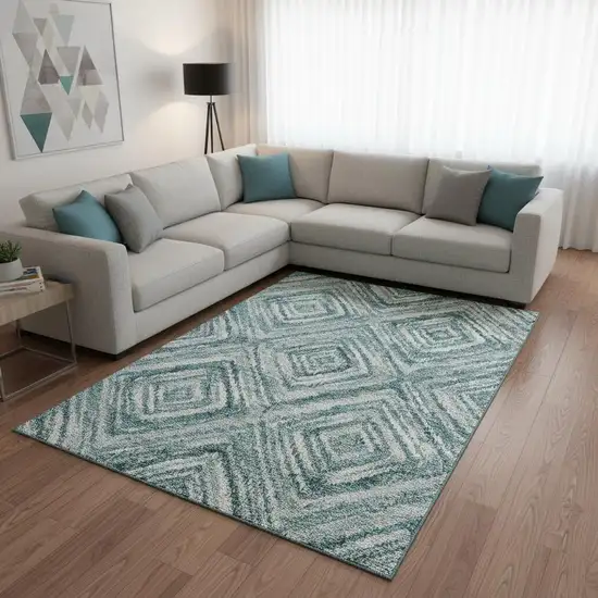 Teal And Ivory Geometric Washable Area Rug With UV Protection Photo 2