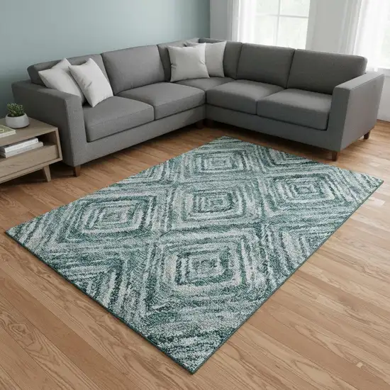 Teal And Ivory Geometric Washable Area Rug With UV Protection Photo 2
