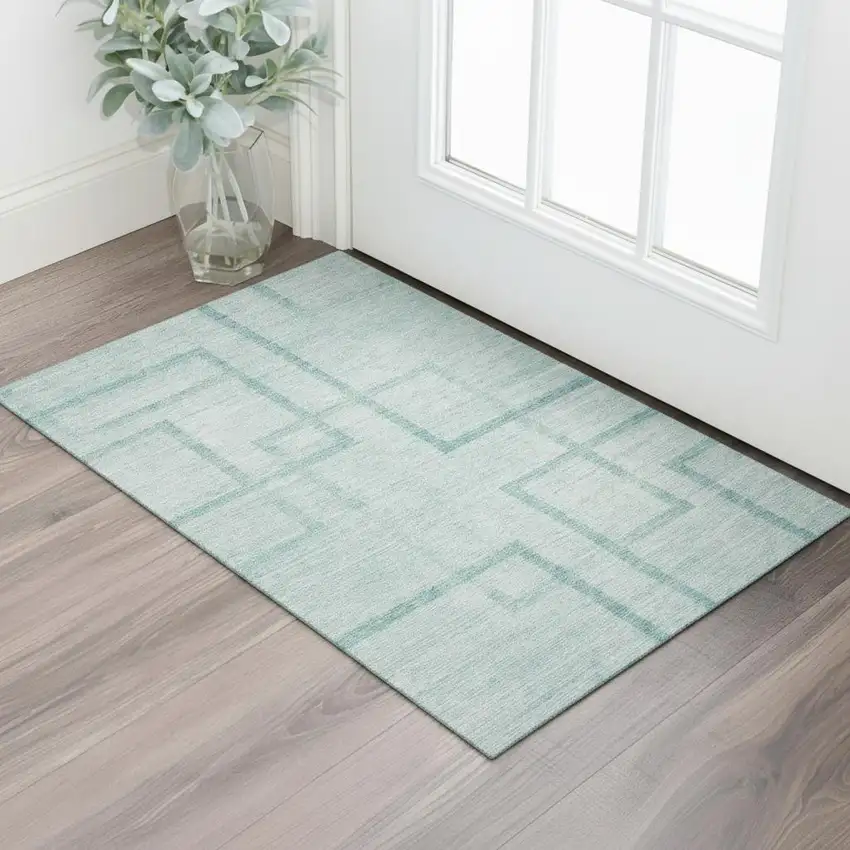 Teal And Ivory Geometric Washable Area Rug With UV Protection Photo 1